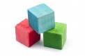 Three colourful wooden blocks